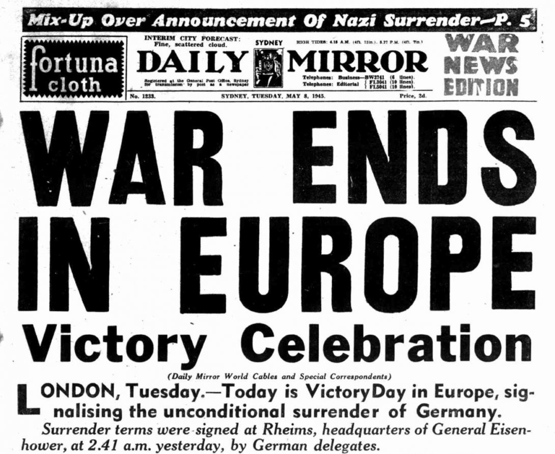 Front page of a newspaper, with very large text reading 'WAR ENDS IN EUROPE Victory celebration'